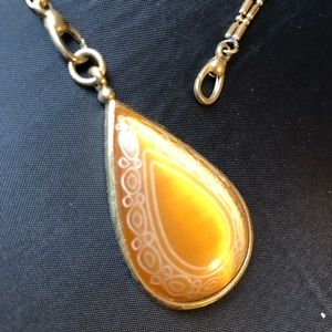 Convertible length gold tone necklace etched stone